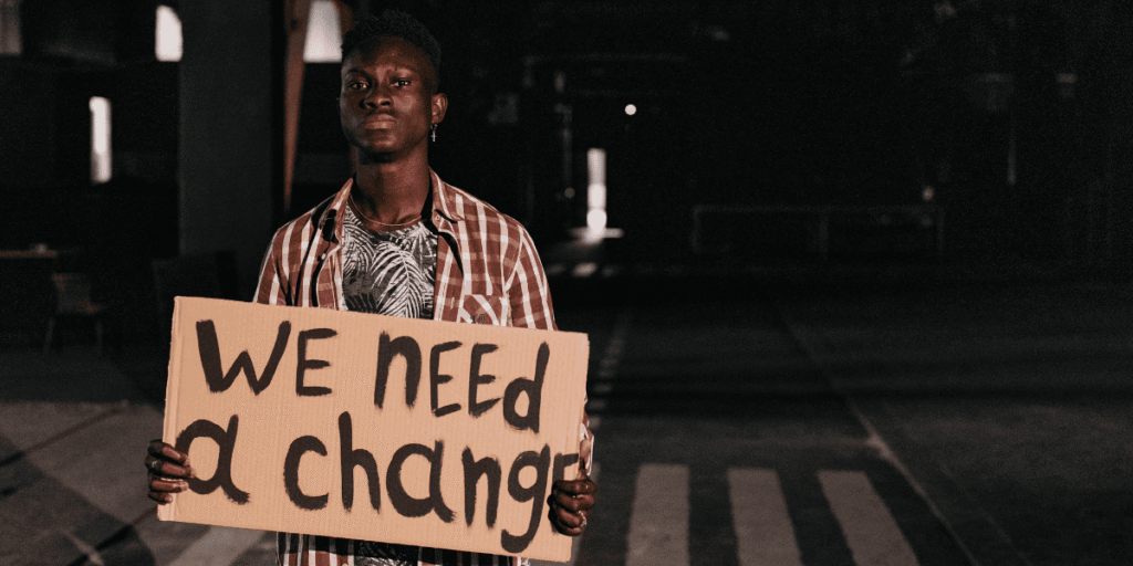 man with banner in protests in Kenya 1